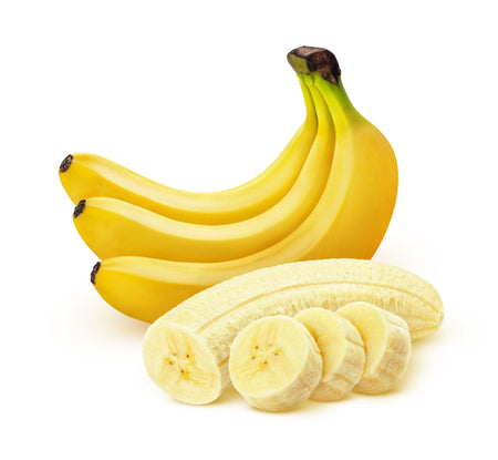 Bananas with a few slices on a white background